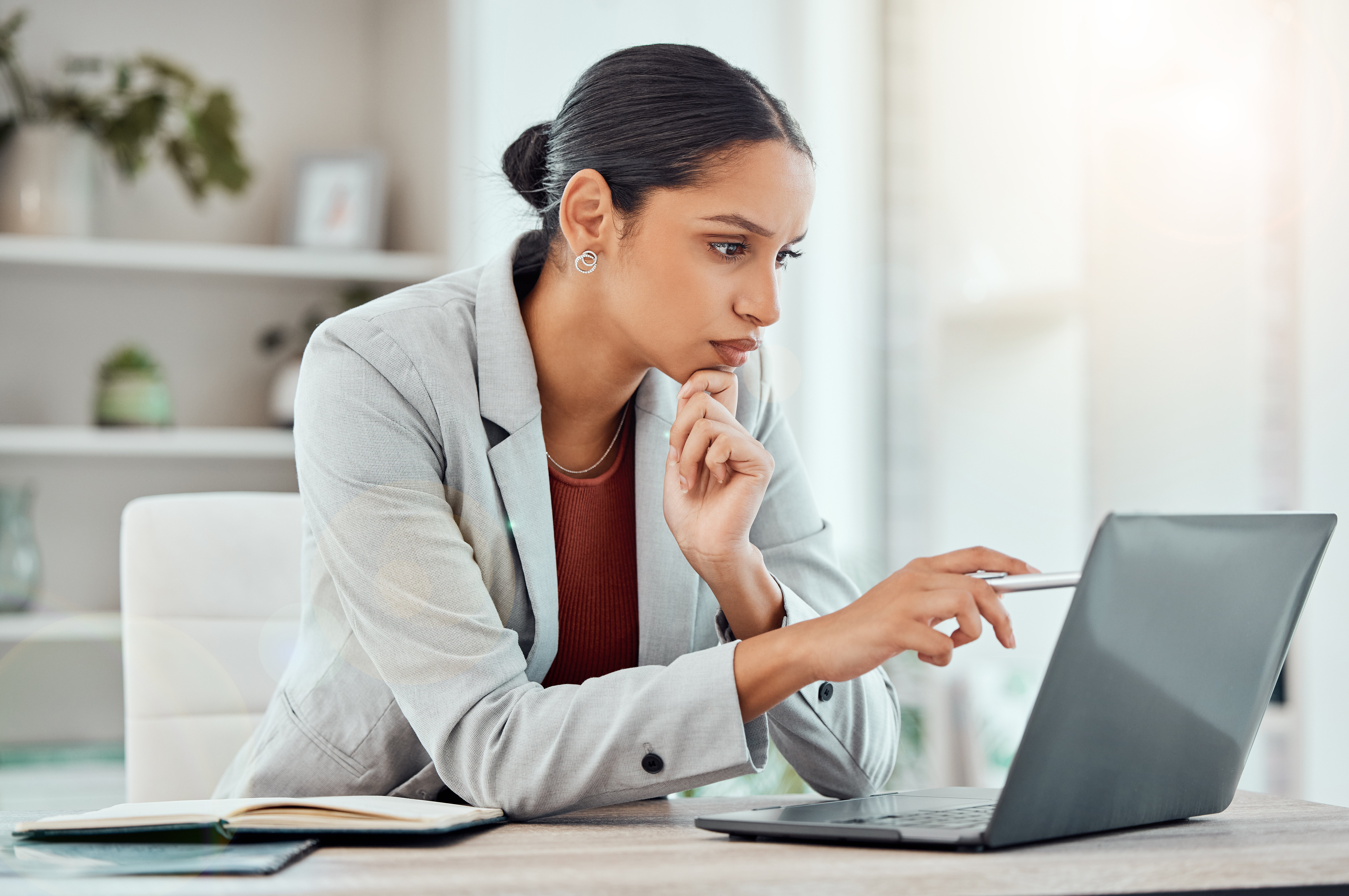 Professional woman focusing on laptop