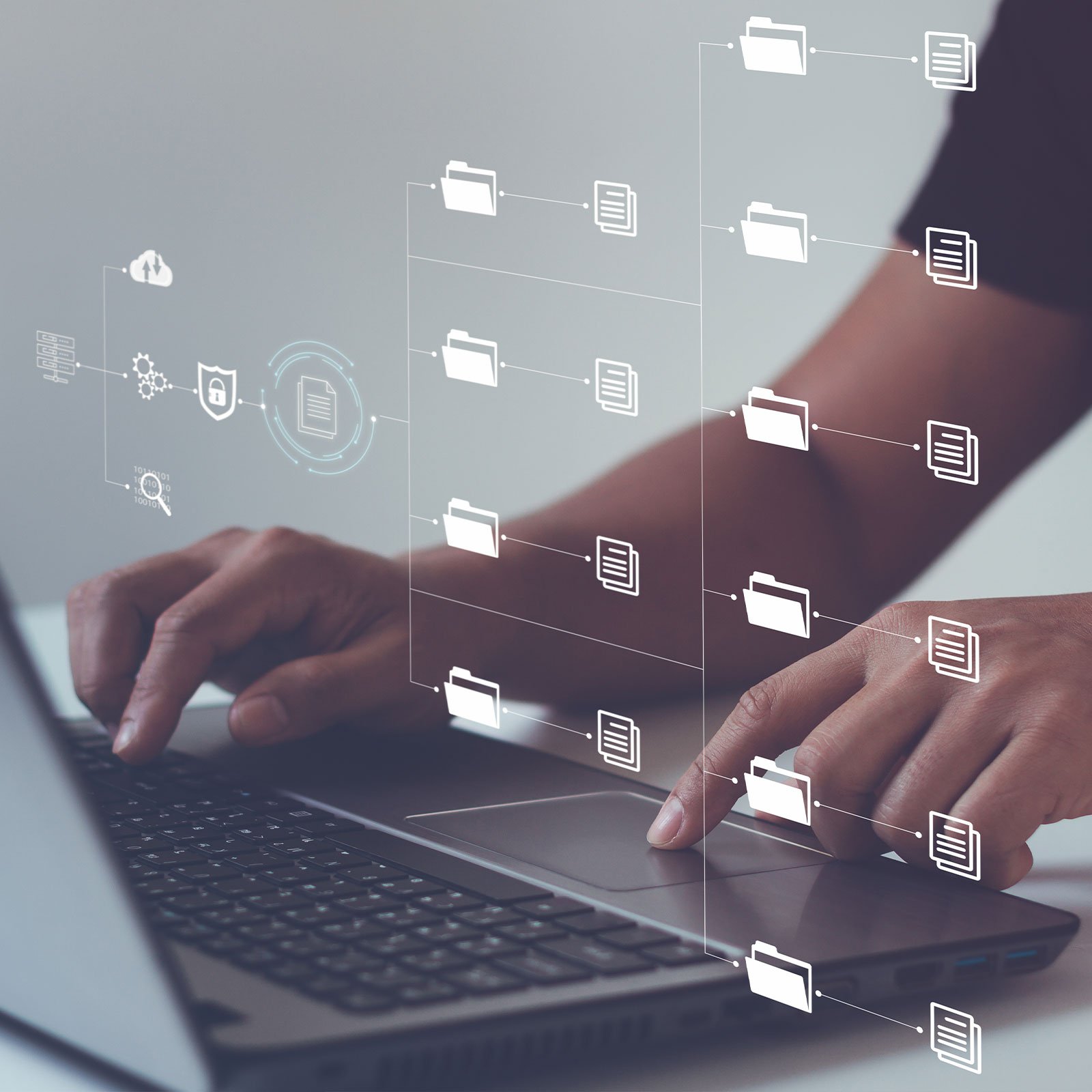 Hands typing on keyboard backing up data