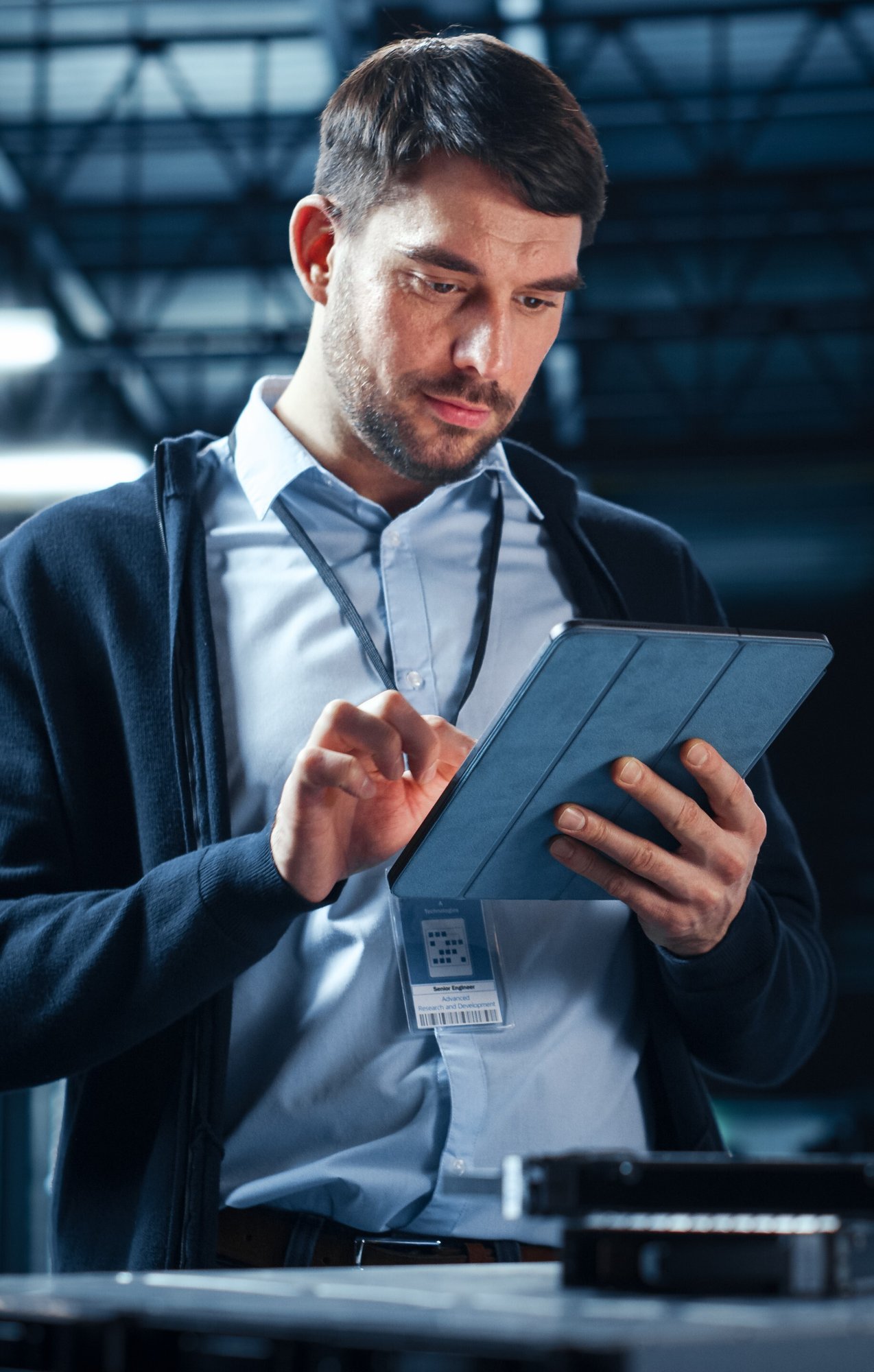 data it specialist looking at tablet