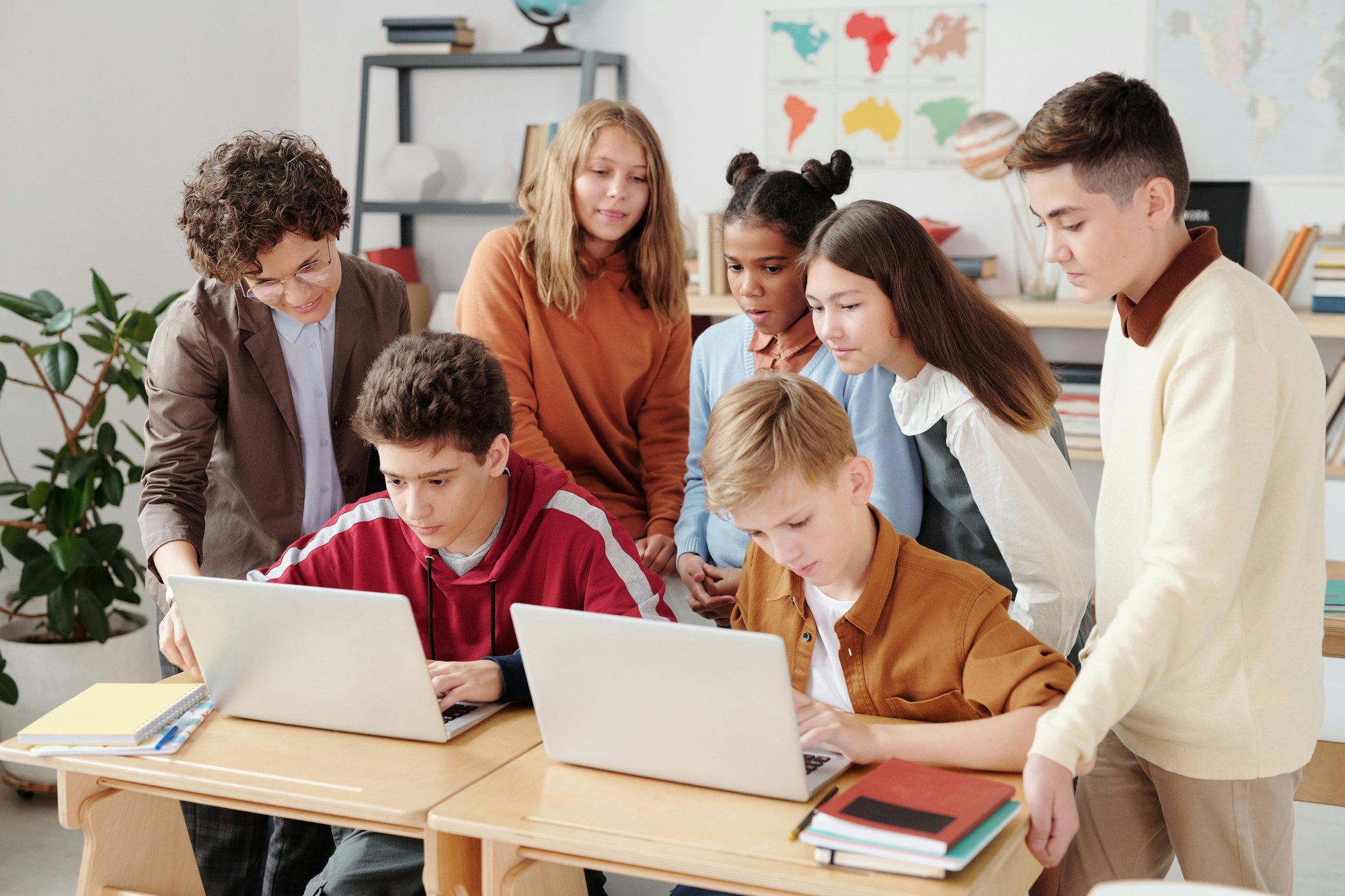 Students using laptops in a modern K-12 classroom